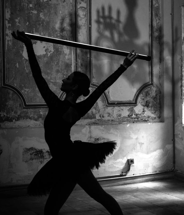 Woman in a calm, graceful pose, representing harmonious movement.